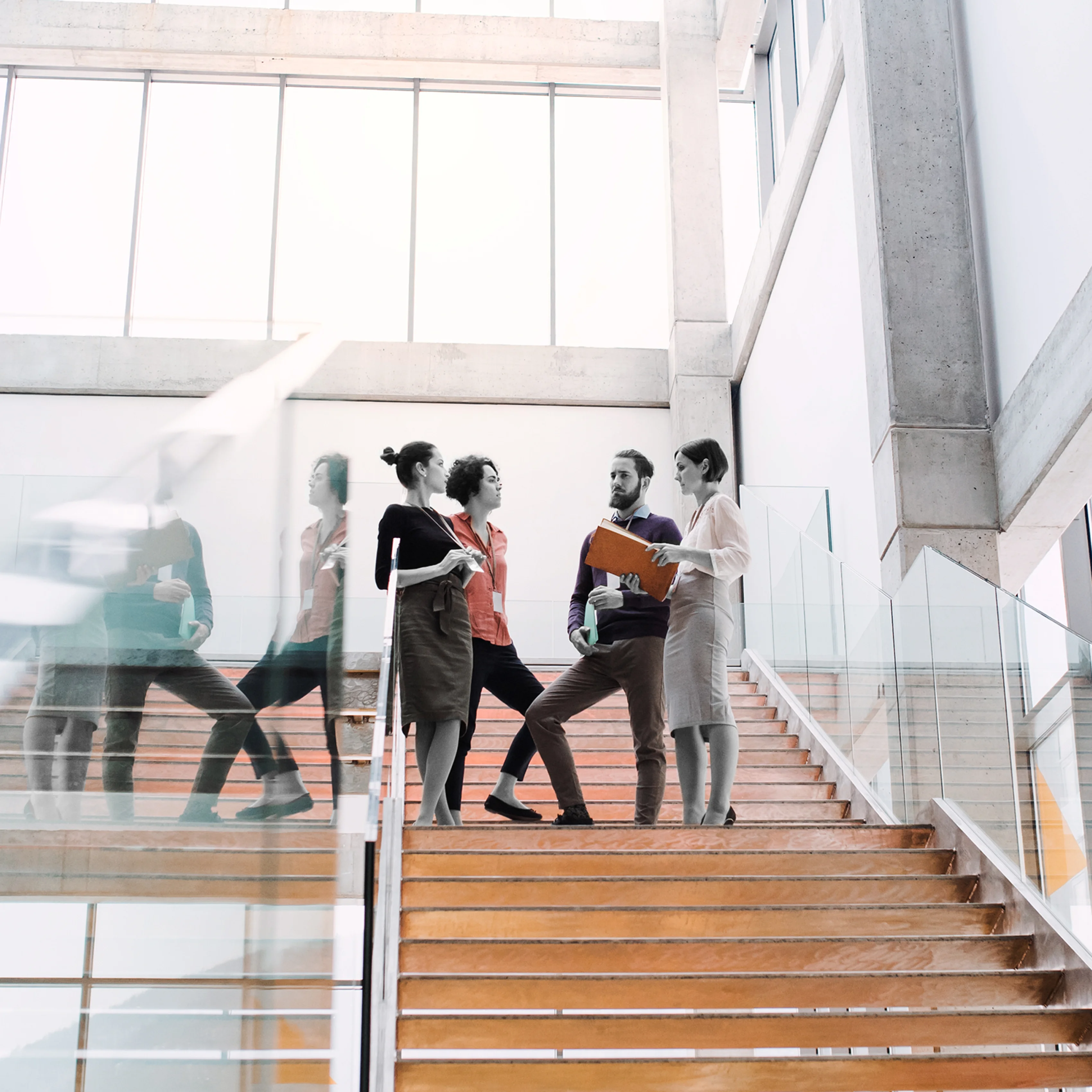 view of workers chatting on a staircase
