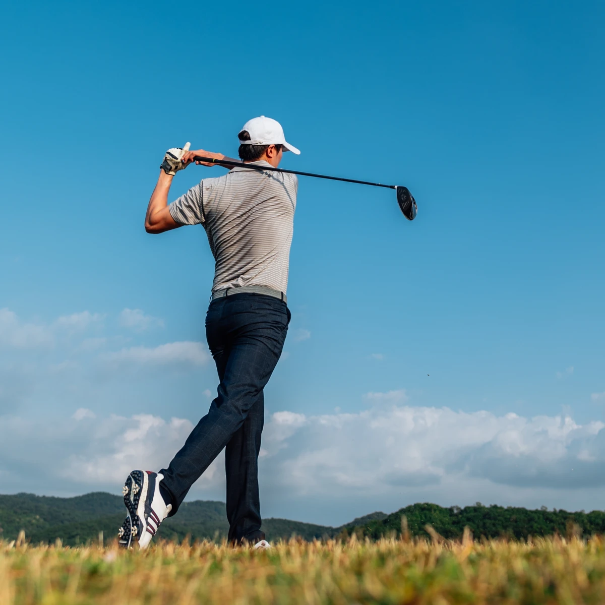 Image of man golfing